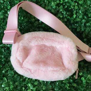 Pink furry pouch with adjustable belt